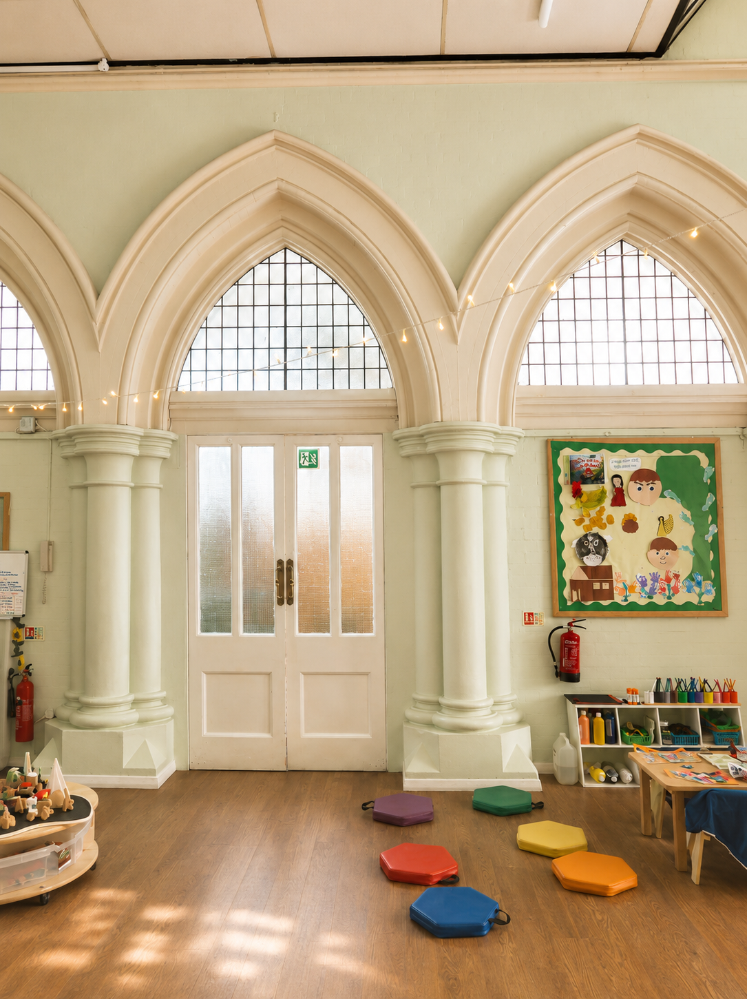 The light-filled gothic arched main room at Baby Grow Nursery in Fulham